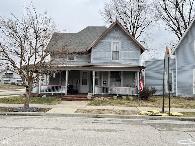 victorian home with a porch and board and batten siding