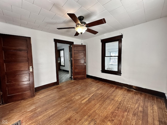 unfurnished bedroom with hardwood / wood-style floors and ceiling fan