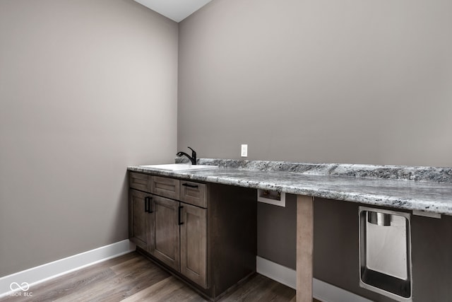 bathroom with sink and hardwood / wood-style floors