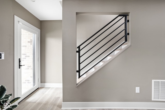 foyer entrance featuring plenty of natural light and light hardwood / wood-style floors