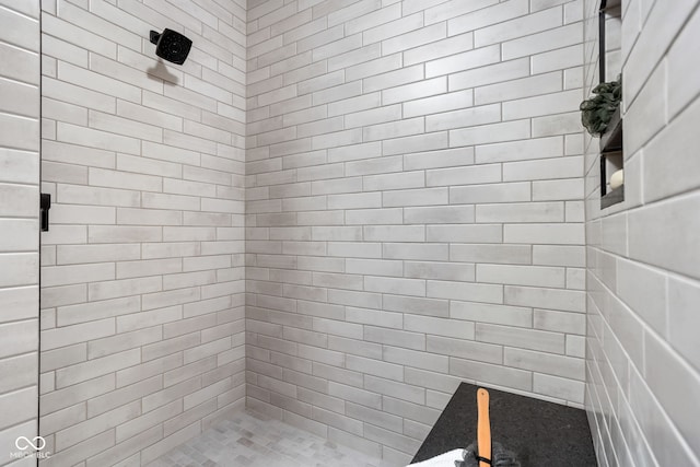 bathroom with a tile shower