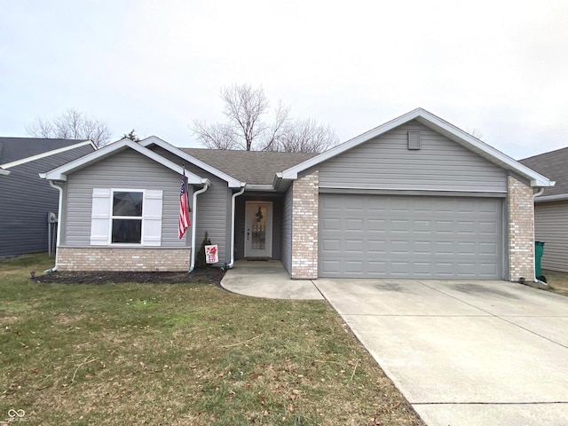 ranch-style house featuring a garage and a front yard