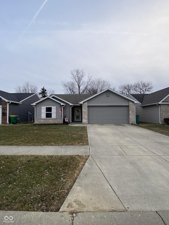 single story home featuring a garage and a front yard