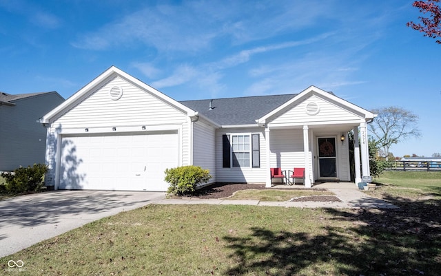 ranch-style home with a garage, a front yard, and covered porch