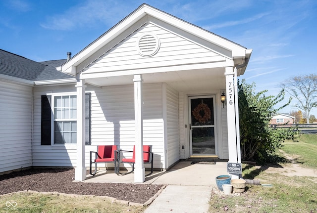 view of exterior entry featuring a porch