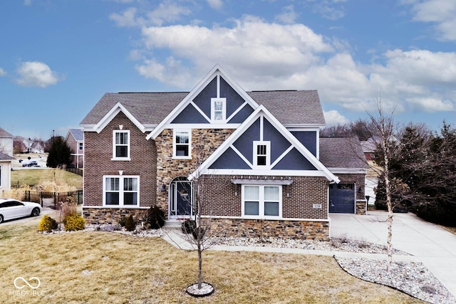 view of front of house with a garage and a front lawn