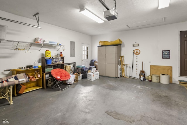 garage featuring electric panel and a garage door opener