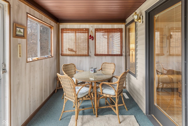 sunroom featuring wood ceiling