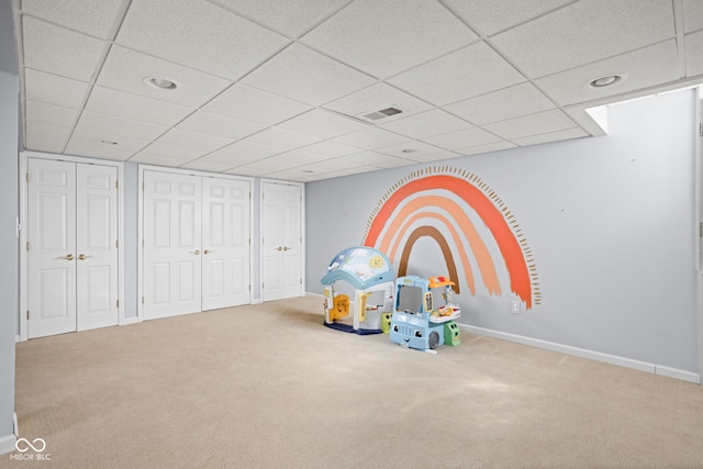 playroom with baseboards, visible vents, and carpet flooring