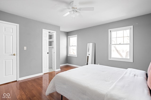 bedroom with ceiling fan, baseboards, and wood finished floors