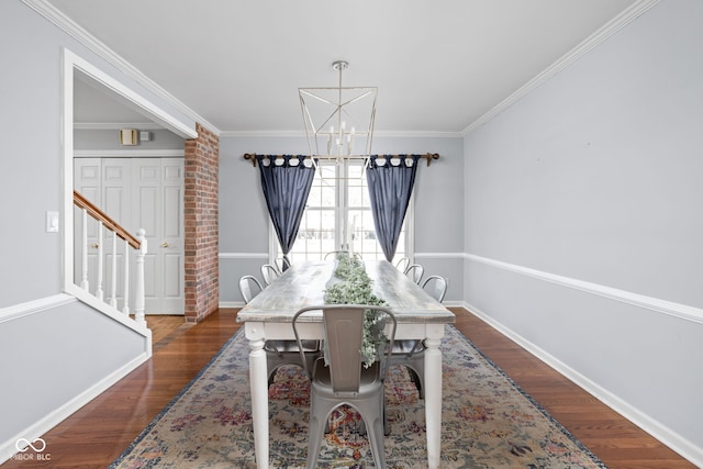 dining area featuring a chandelier, crown molding, dark wood finished floors, and baseboards