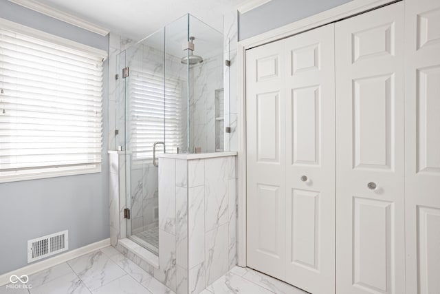 full bathroom with marble finish floor, visible vents, baseboards, and a marble finish shower