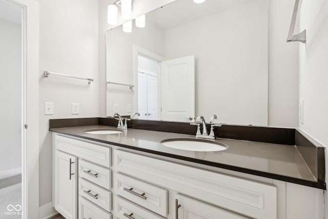 bathroom with double vanity and a sink