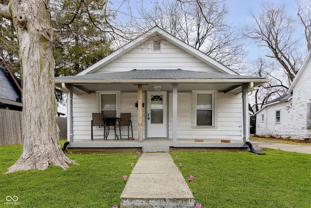 bungalow-style house featuring a front lawn and a porch