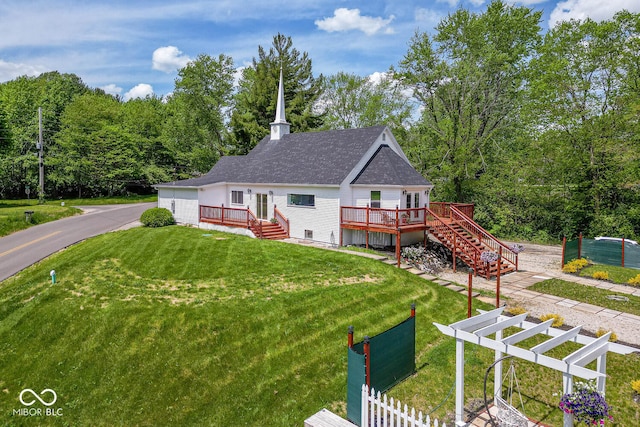 view of front facade featuring a deck and a front lawn