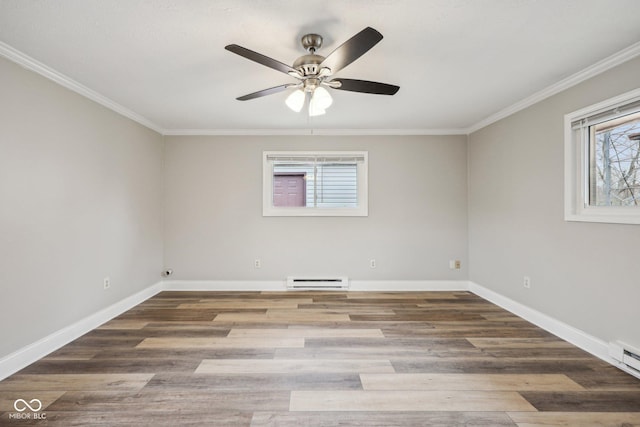 spare room featuring a baseboard heating unit, wood-type flooring, and ornamental molding