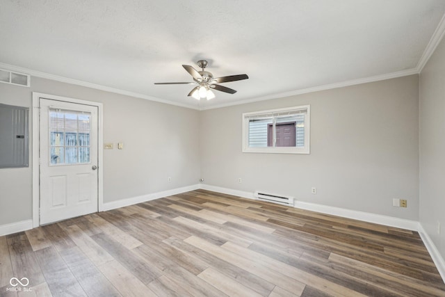 empty room with crown molding, a baseboard radiator, electric panel, hardwood / wood-style flooring, and ceiling fan