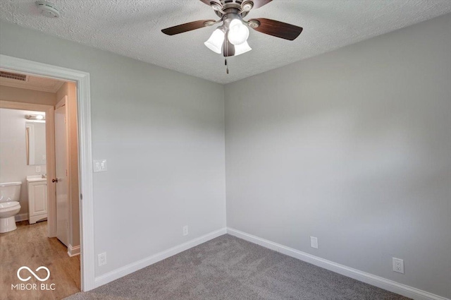 1002 Payton Ave, Indianapolis, IN 46219 - carpeted spare room featuring ceiling fan and a textured ceiling