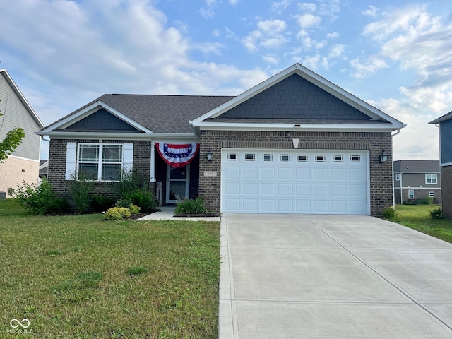 view of front of home with an attached garage, a front yard, concrete driveway, and brick siding