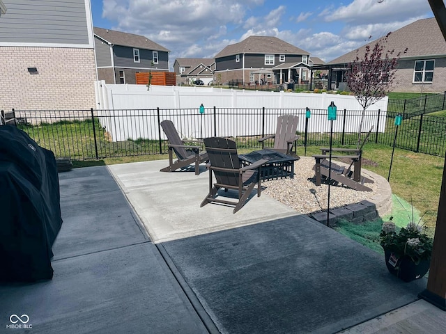 view of patio featuring a residential view, fence, and area for grilling