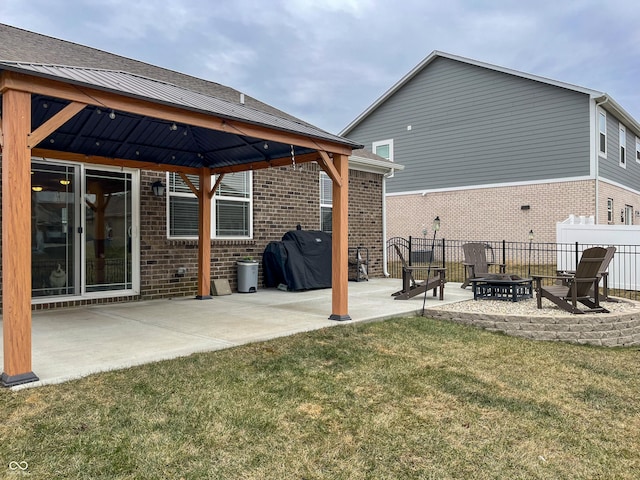 exterior space featuring a fire pit, a yard, a gazebo, and a patio area