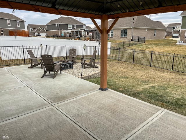 view of patio / terrace with a gazebo and a fire pit