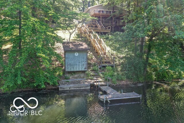 dock area with a water view and stairs