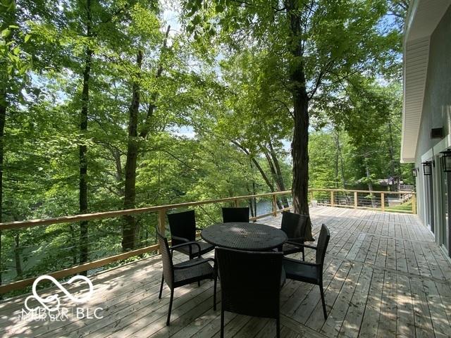 wooden terrace featuring outdoor dining area