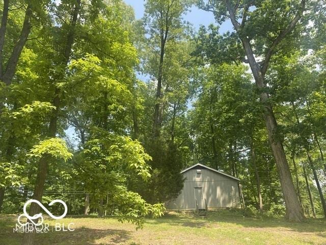 view of yard with an outbuilding and a pole building