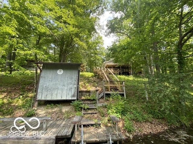 view of shed with stairs