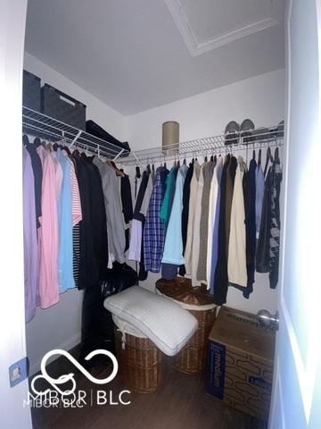 spacious closet with wood finished floors