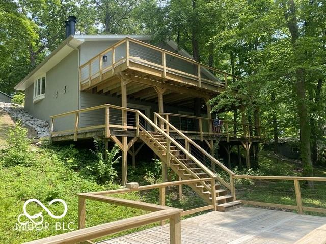 exterior space featuring a deck and stairway