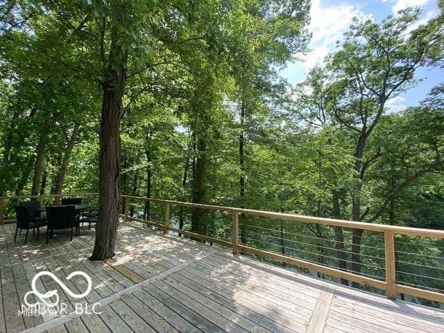 wooden deck with outdoor dining space