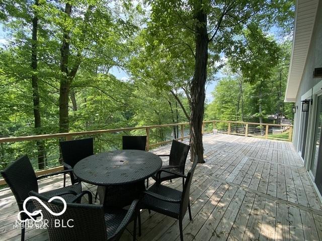 deck with outdoor dining area