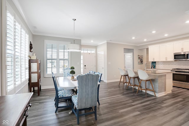 dining room featuring dark hardwood / wood-style flooring and ornamental molding