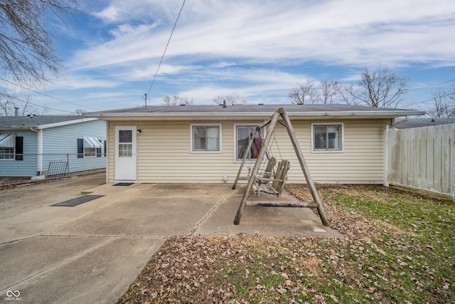 rear view of property featuring a patio