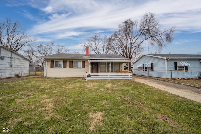 ranch-style home with a porch and a front lawn