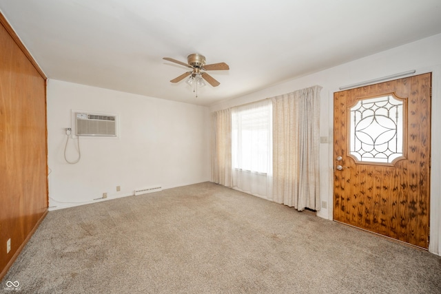 interior space with ceiling fan and a wall mounted AC