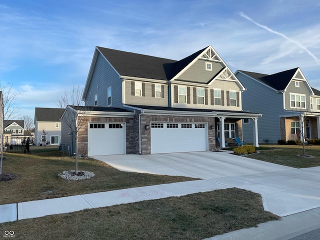 view of front of home with a garage and a front lawn