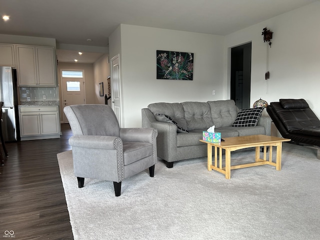 living room featuring dark wood-type flooring