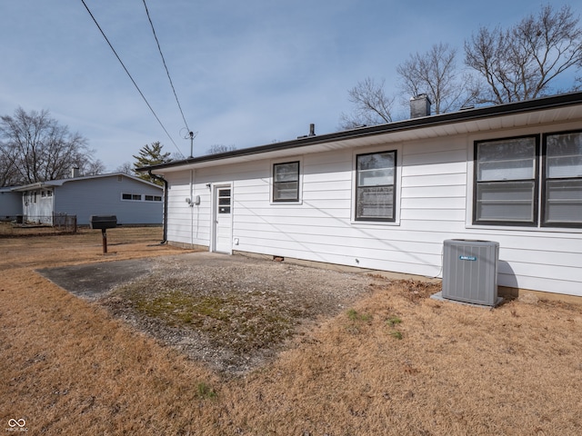 back of house with cooling unit