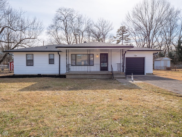 single story home featuring a garage, covered porch, and a front yard