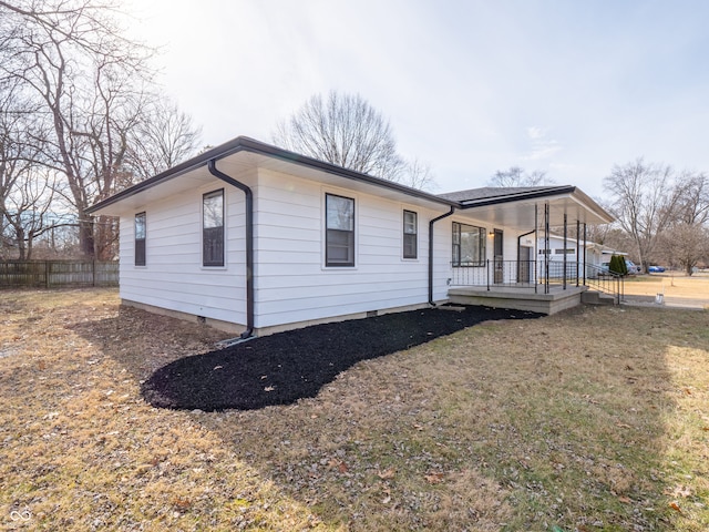 exterior space featuring a porch and a front lawn