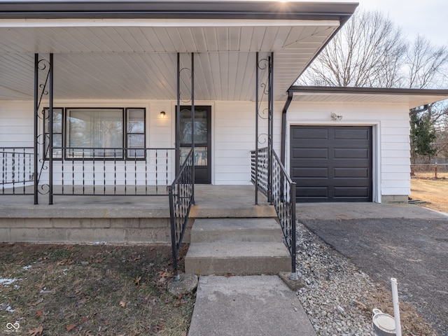 view of front facade with a garage and a porch