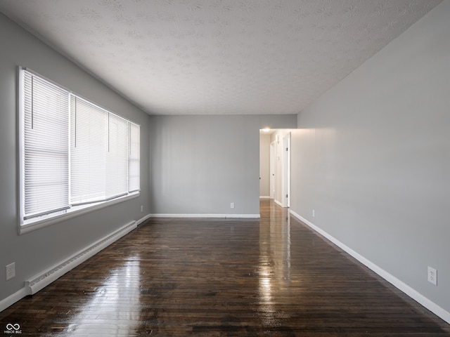 unfurnished room featuring a baseboard radiator, dark hardwood / wood-style flooring, and a textured ceiling