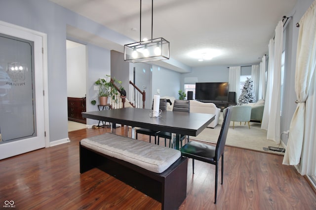 dining area with dark wood-type flooring