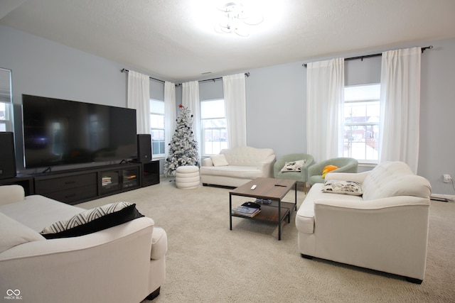 living room with light carpet and a textured ceiling