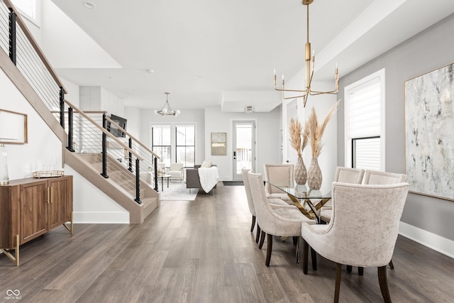 dining room featuring dark hardwood / wood-style flooring and a chandelier