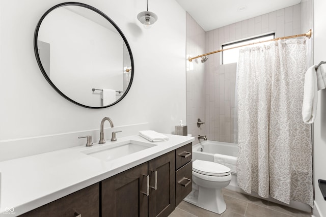 full bathroom with shower / bathtub combination with curtain, vanity, tile patterned floors, and toilet