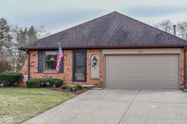 view of front of house featuring a garage and a front lawn